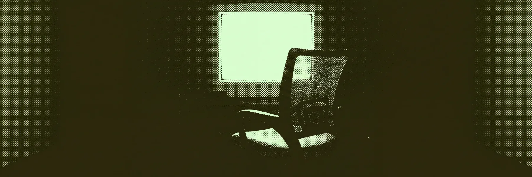 An empty chair in front of a glowing monitor. Nobody is there.